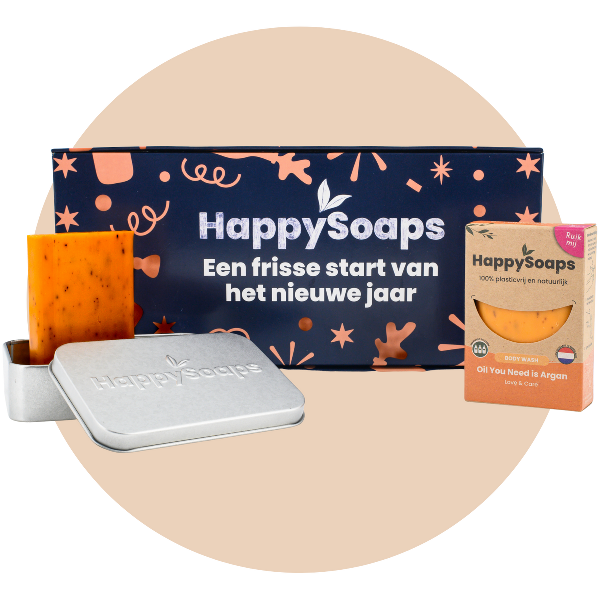 Nieuwjaarscadeau Giftbox van HappySoaps met het rechthoekige reisblikje en de Body Wash Bar Oil You Need is Argan, uitgepakt en in de wikkel getoond